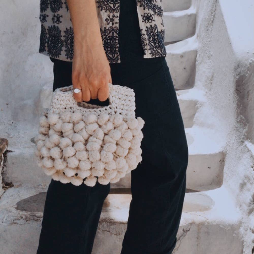 “Nadia pom-pom” handbag