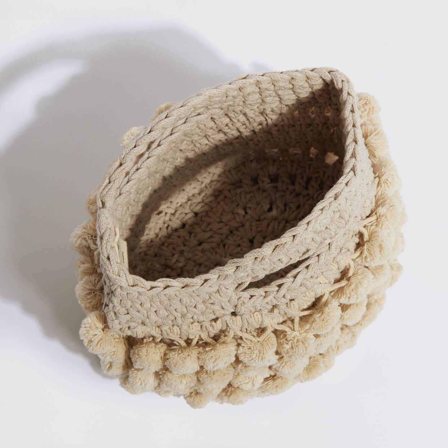 “Nadia pom-pom” handbag