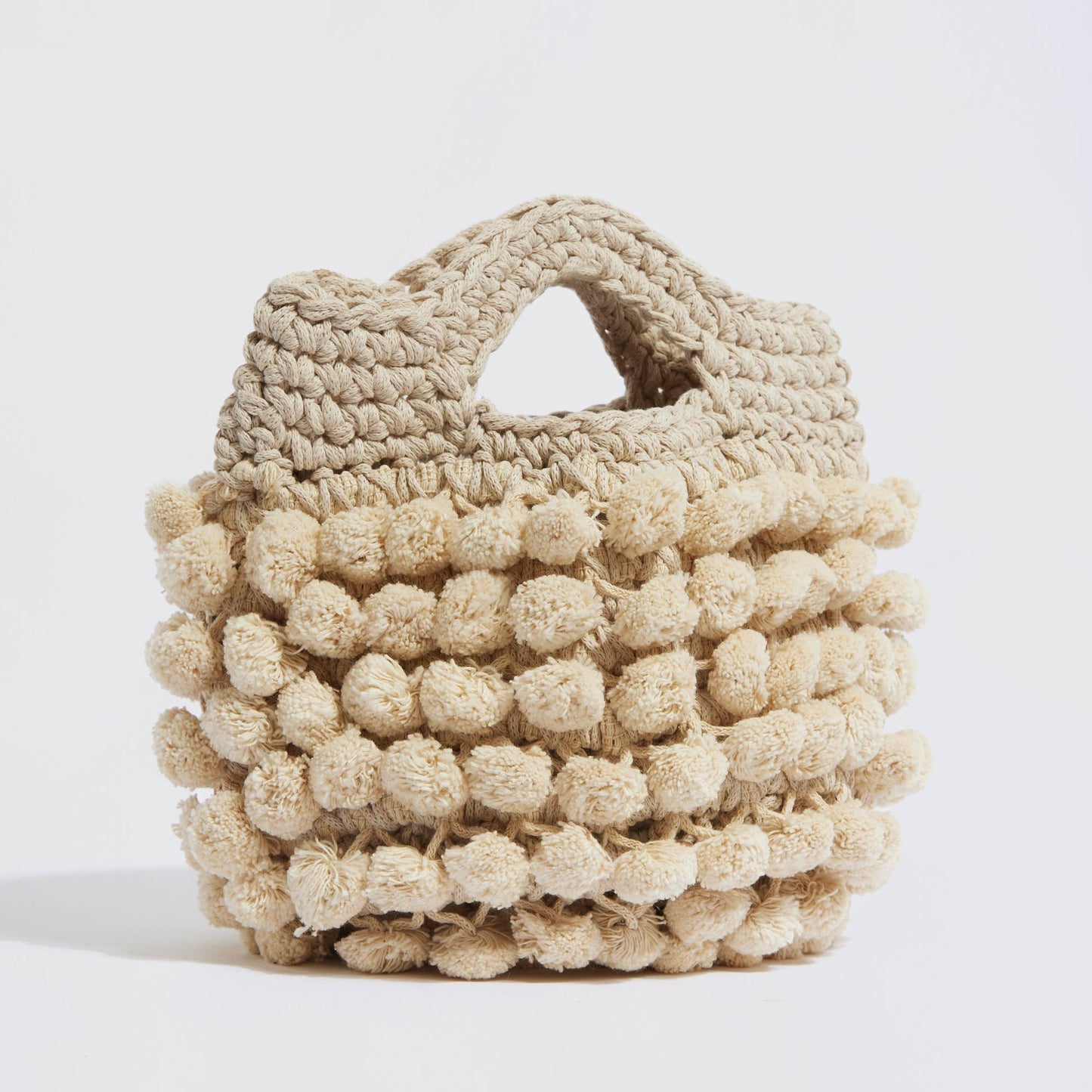 “Nadia pom-pom” handbag