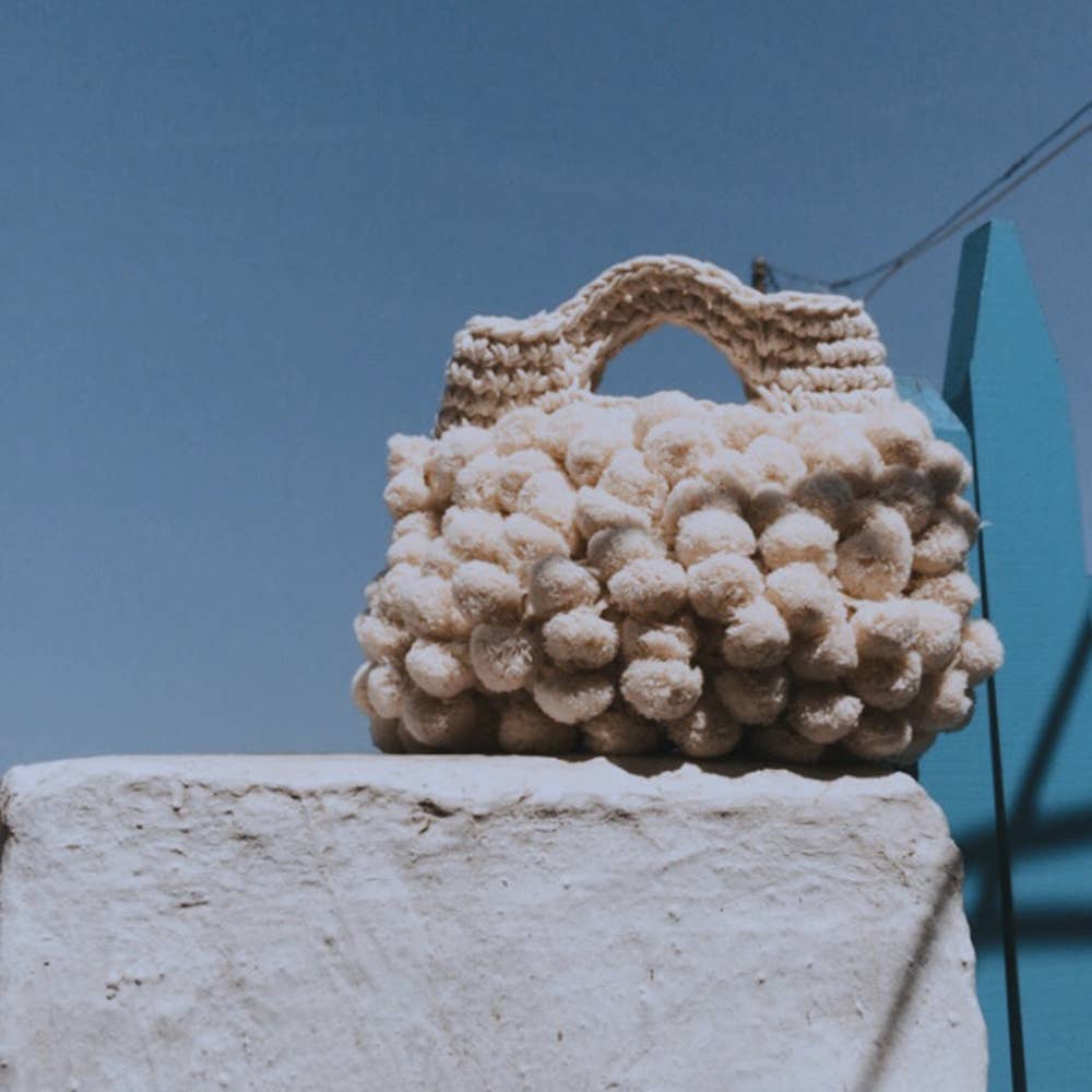 “Nadia pom-pom” handbag